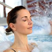 A lady relaxing in the spa pool jets.